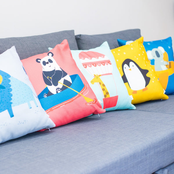throw pillow for sofa, animal print pillows as a colour pop lined on a grey ikea sofa