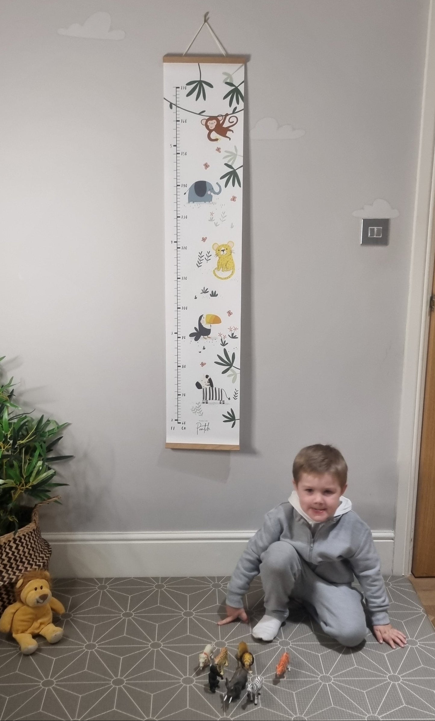 Jungle themed kids height chart made from canvas with wooden frame and hanging cord by Made by Paatch.