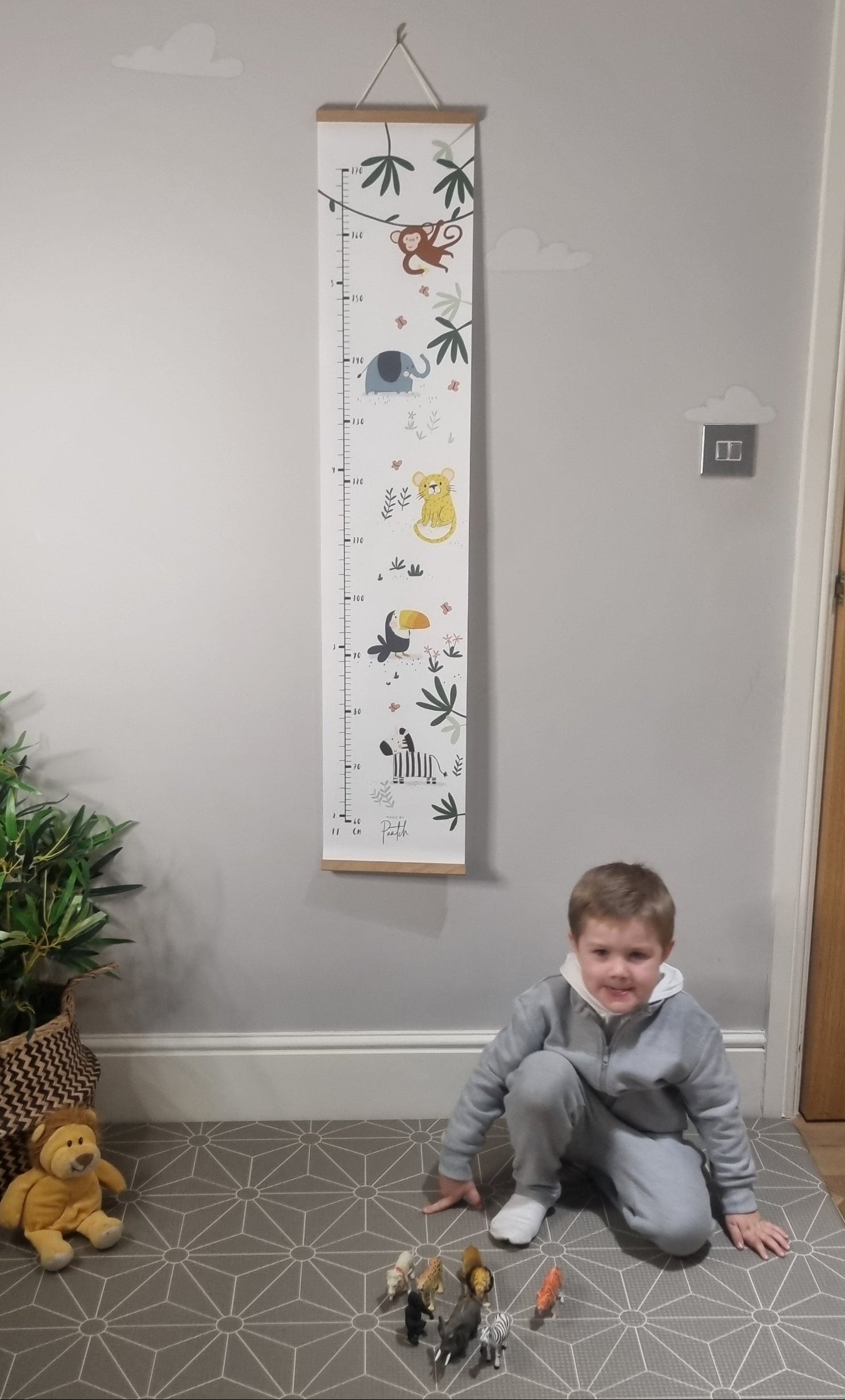 Jungle themed kids height chart made from canvas with wooden frame and hanging cord by Made by Paatch.