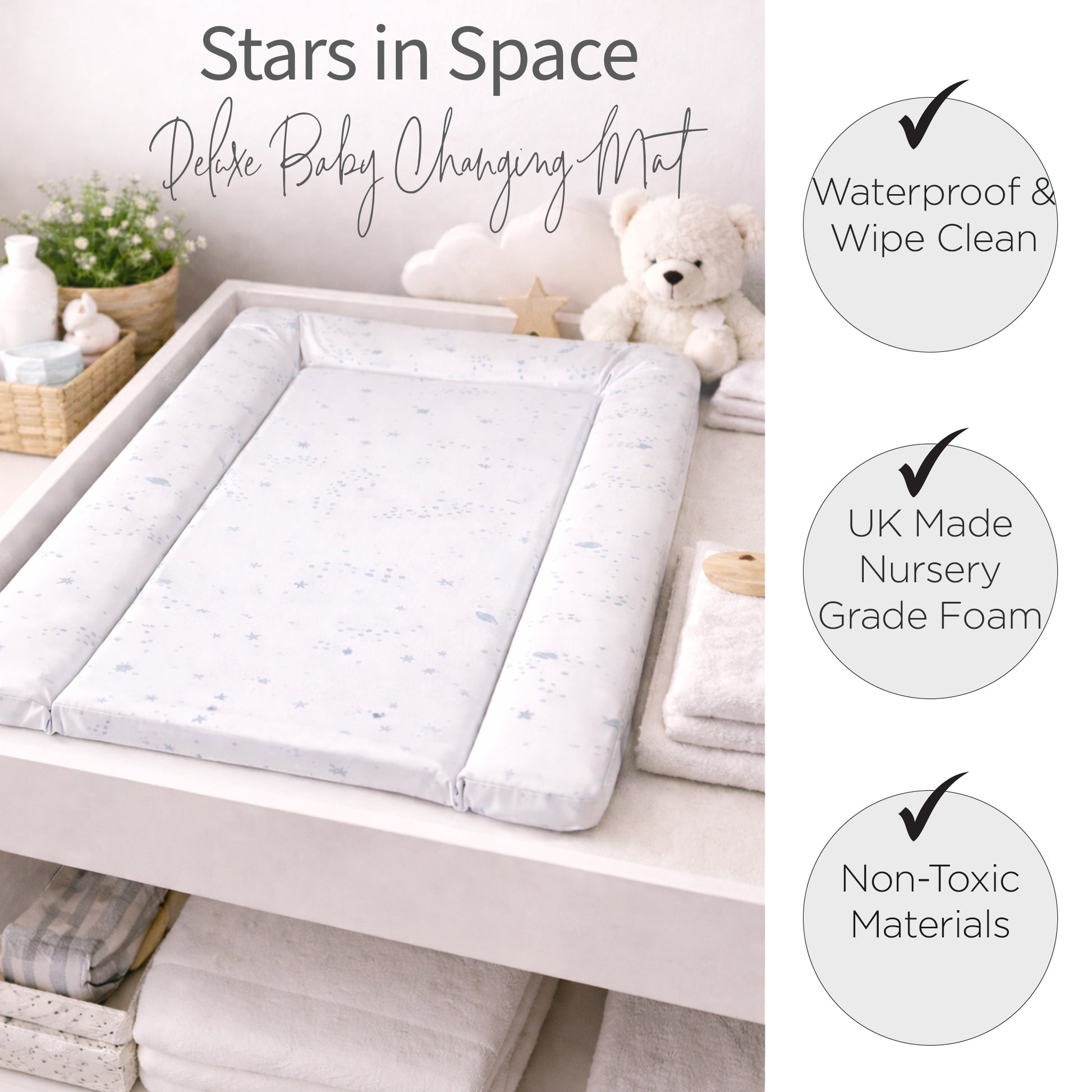 Baby changing mat with teddy bear, bottles, and plants on a white background