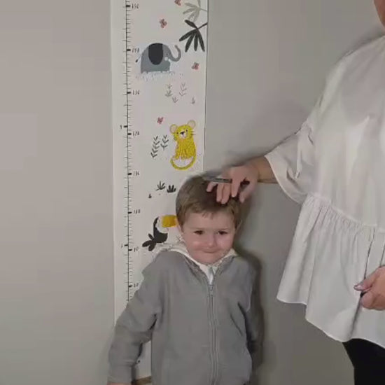 Jungle Height Chart with toddler being measured.