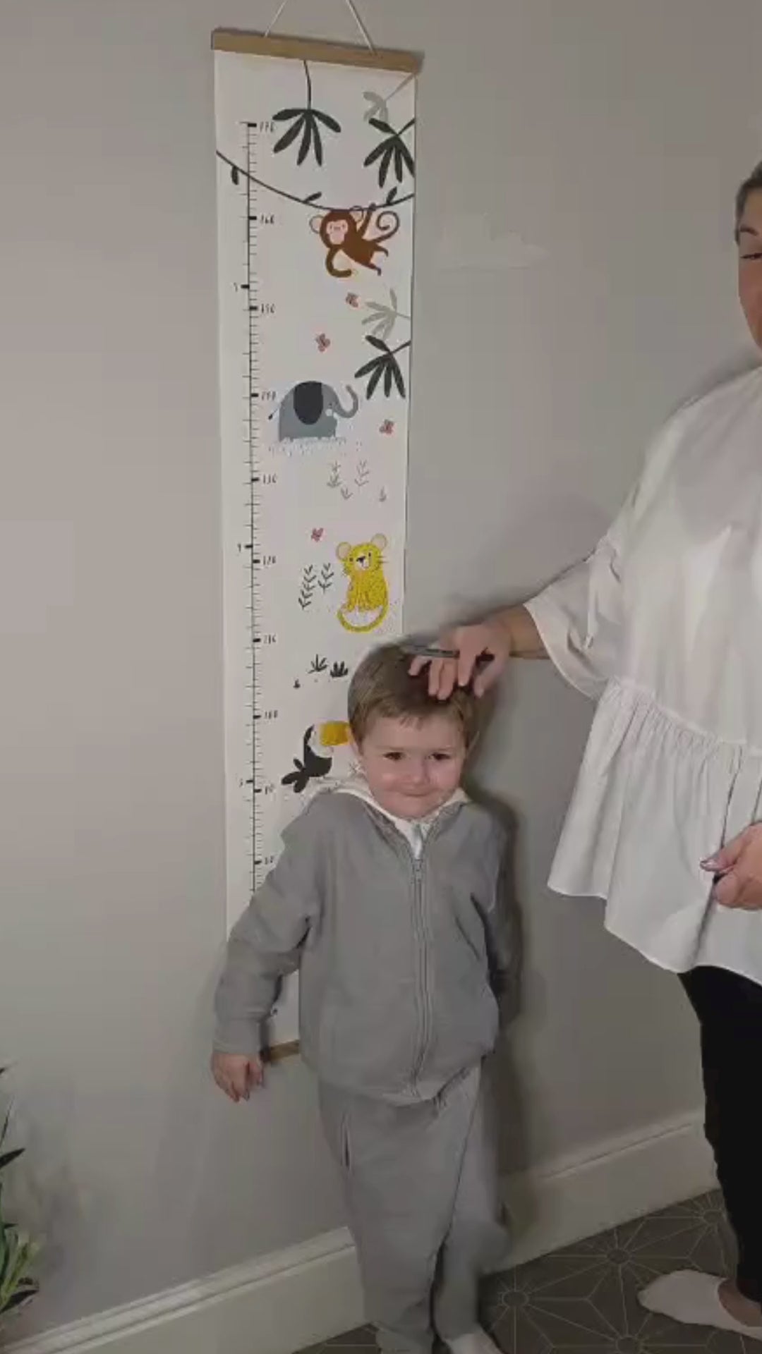 Jungle Height Chart with toddler being measured.