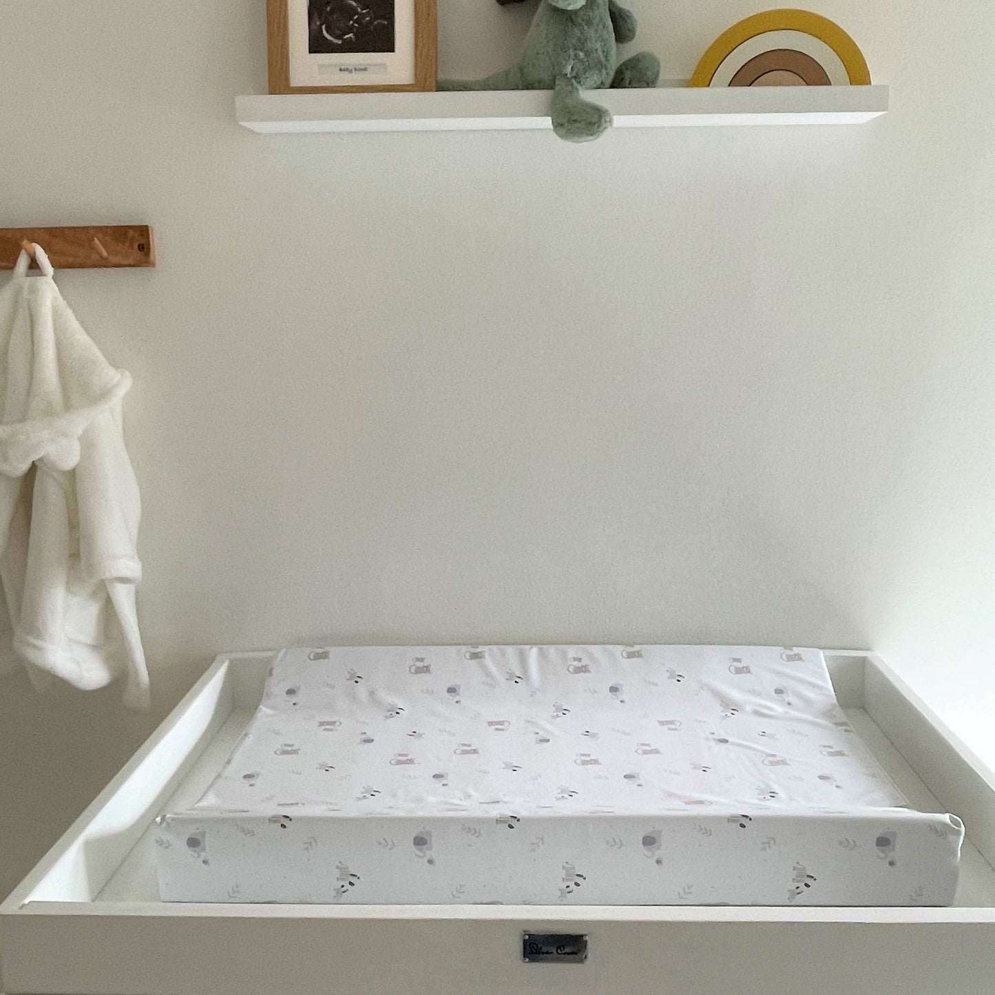 baby nursery accessories with a sloped, anti roll, wedge changing mat